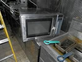 Commercial microwave oven badly fire damaged.