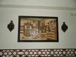 A stone mosaic panel on the wall which required cleaning following the restaurant kitchen fire.