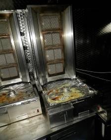 Restaurant kitchen vertical kebab spits damaged in the fire.