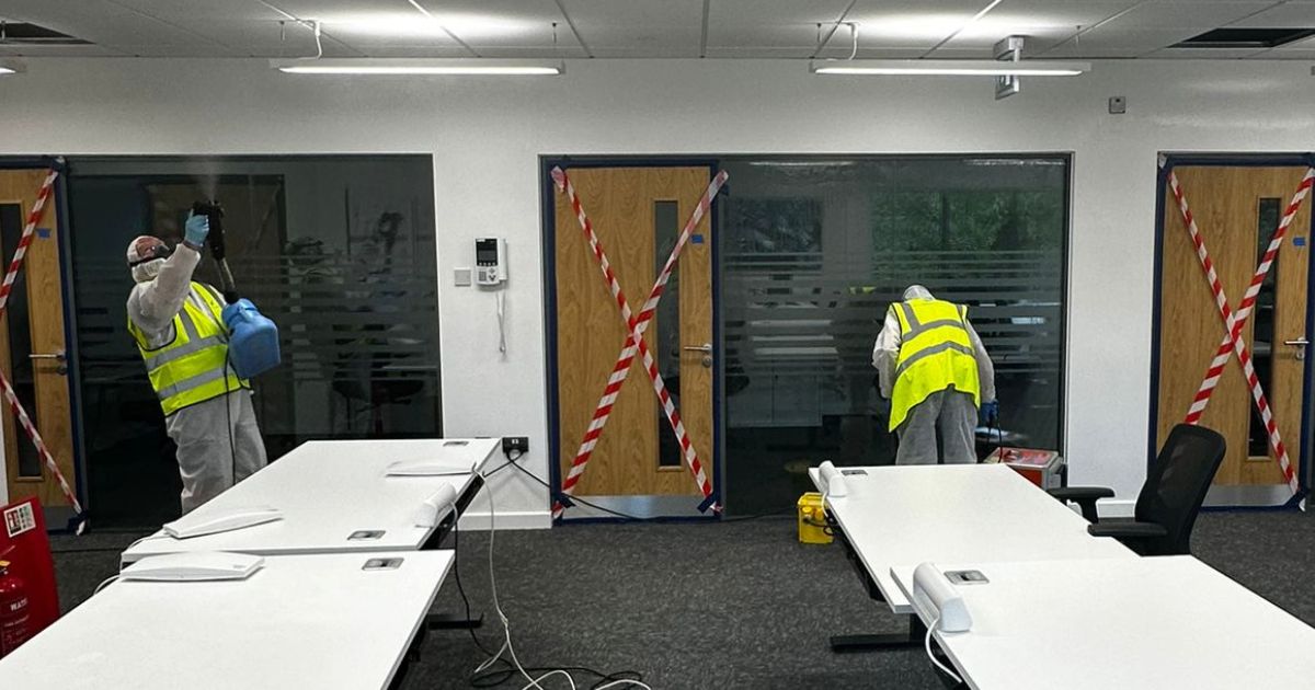 Vinci technicians wearing PPE eqipment removing mould from a commercial property,