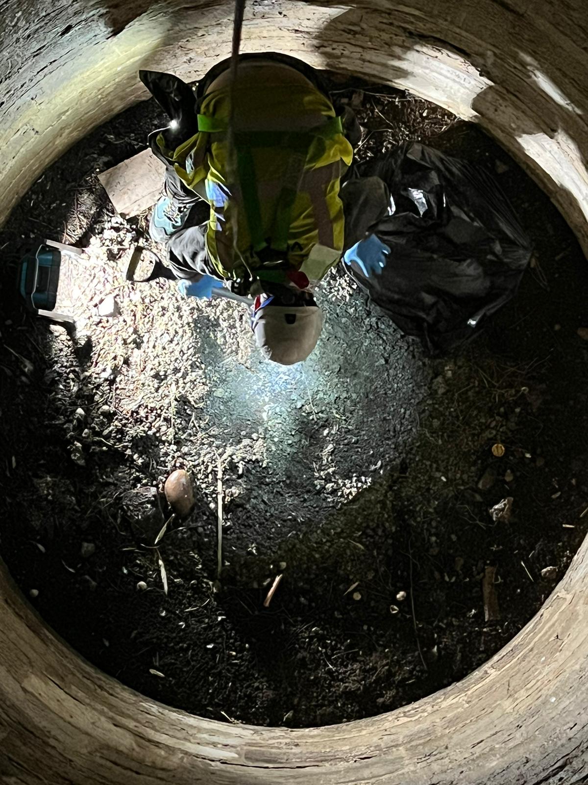 Vinci technicians removing rubbish and guano from a chamber at Amberely Castle in West Sussex